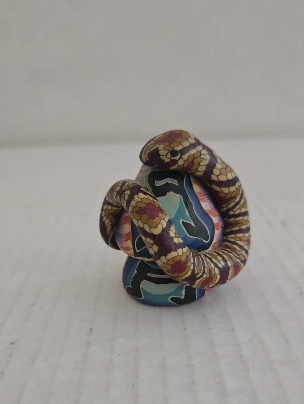 Clay Snake on Colorful Mushroom